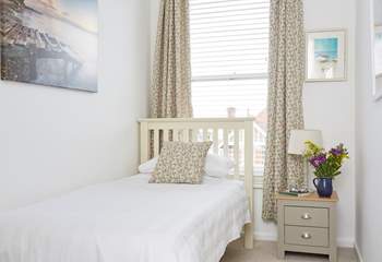 The cosy third bedroom has a single bed which is perfect for an adult or child. 