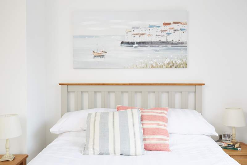 The pretty and bright second bedroom overlooks the garden at Sanderling.