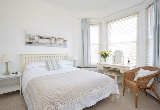 The comfortable and bright main bedroom with an en suite shower-room on the first floor overlooking the front of Sanderling.