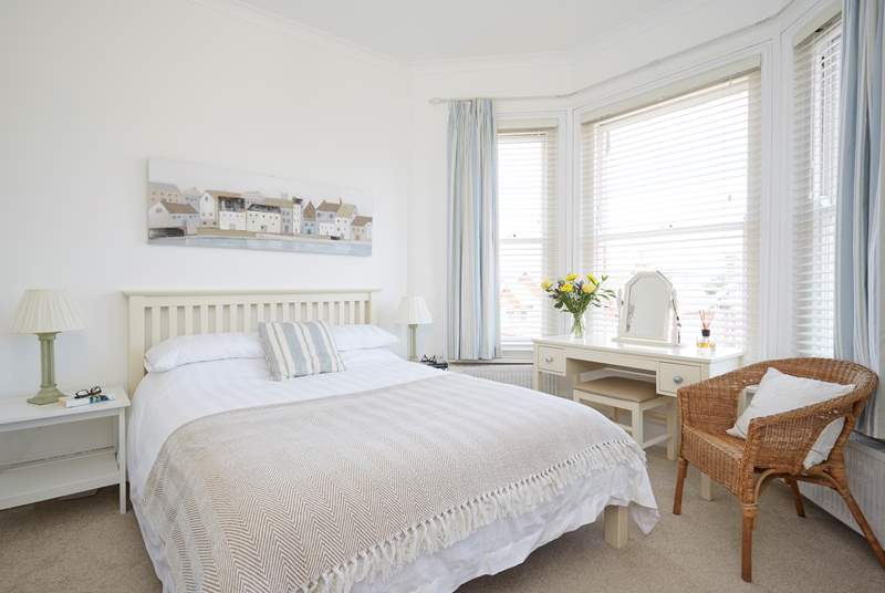 The comfortable and bright main bedroom with an en suite shower-room on the first floor overlooking the front of Sanderling.