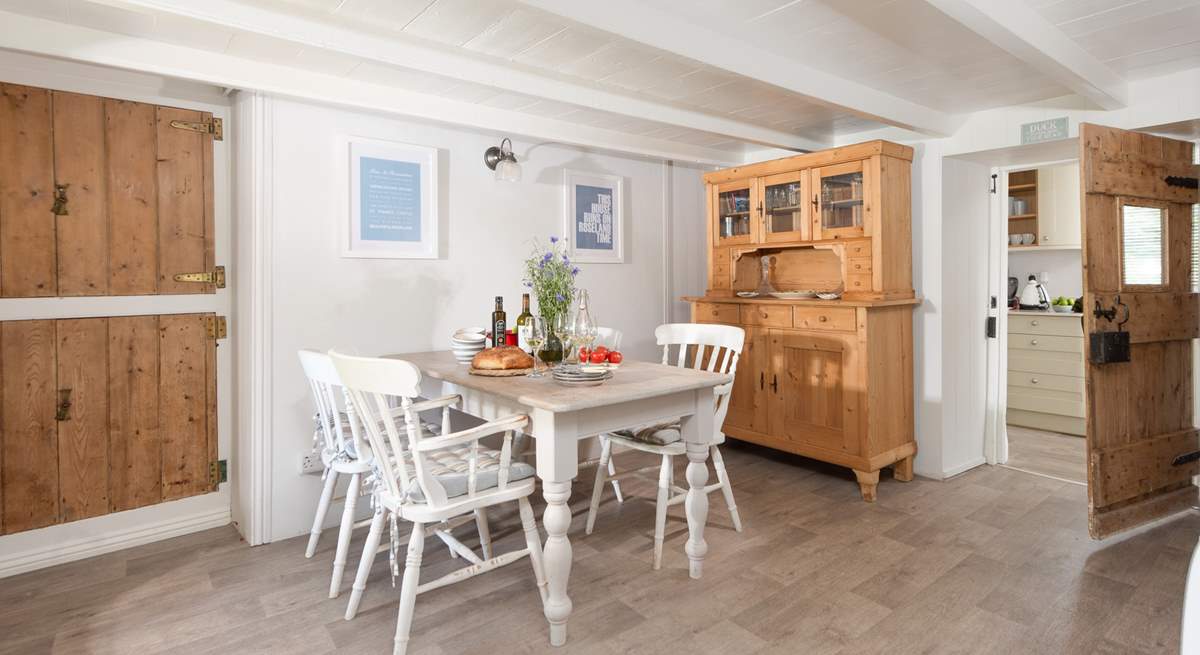 The dining-room leads through to the kitchen.