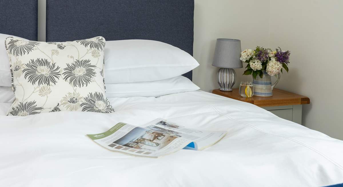 The bed linens ensure a restful night. 