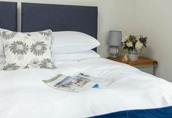 The bed linens ensure a restful night. 