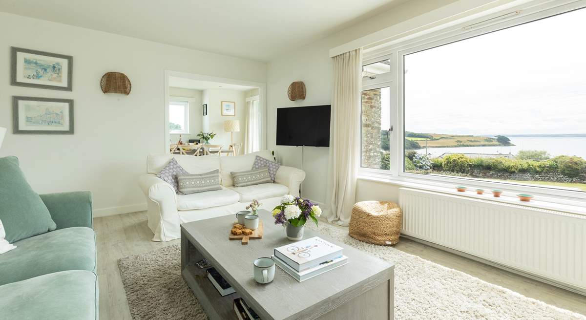 The open plan living-room has stunning views across the Carrick Roads. 