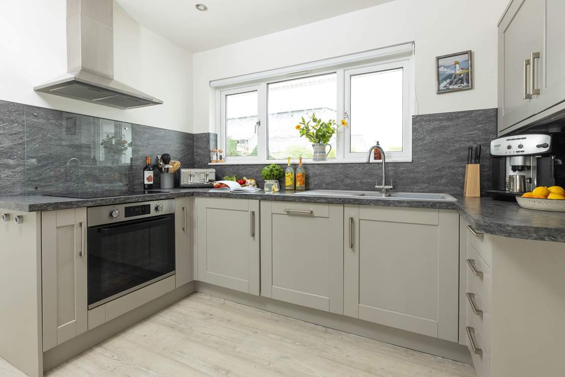 The stylish kitchen has all you need to cook a fabulous holiday meal. Please note the bean to cup coffee maker is no longer available.