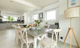 The dining-table sits in between the kitchen and sitting-room.  - Thumbnail Image