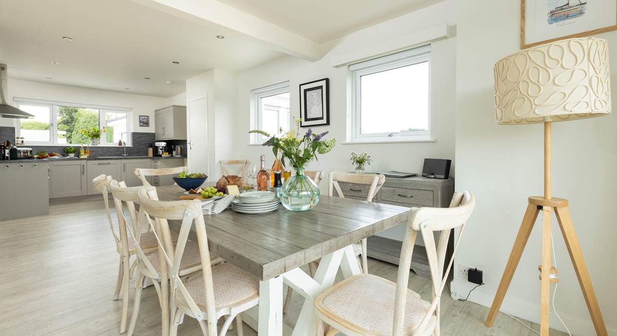 The dining-table sits in between the kitchen and sitting-room. 