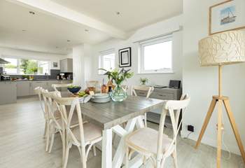 The dining-table sits in between the kitchen and sitting-room. 