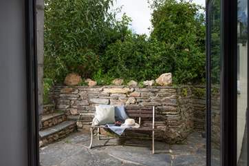 The bi-fold doors from the dining-area lead out to the back garden.
