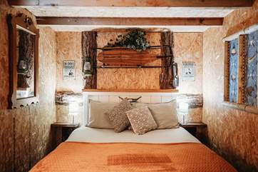 The king-size bed promises a restful night's sleep.