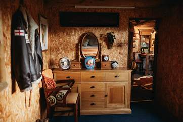 The entrance hall has plenty of room for luggage, bags and cowboy boots.