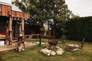 As dusk falls light the fire-pit and cook up a storm over the flickering flames.