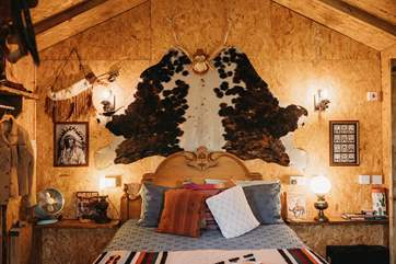 Warm lighting and gorgeous soft furnishings create a cosy, inviting atmosphere.