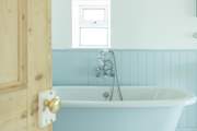 This bathroom has dual access from the hall and from bedroom 5.