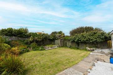 The lawn is a sun-trap in the summer. Allotments are in the rear corner.