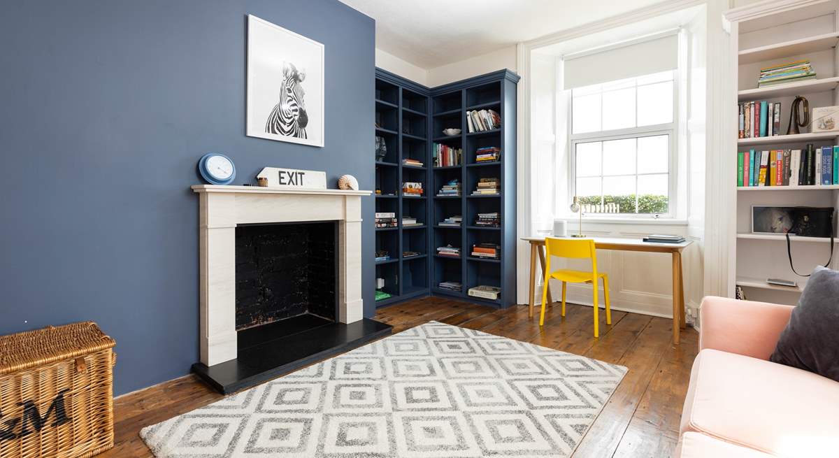 The library features this fabulous ornamental fireplace.