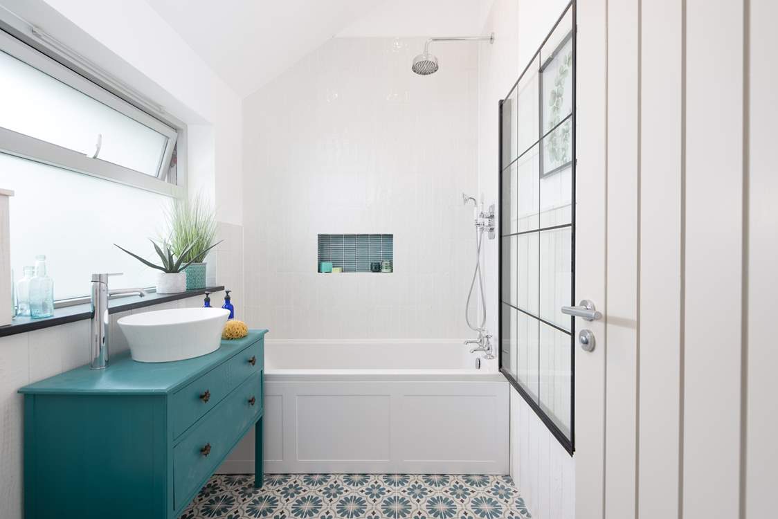 Bedroom two has a very stylish en suite bathroom.