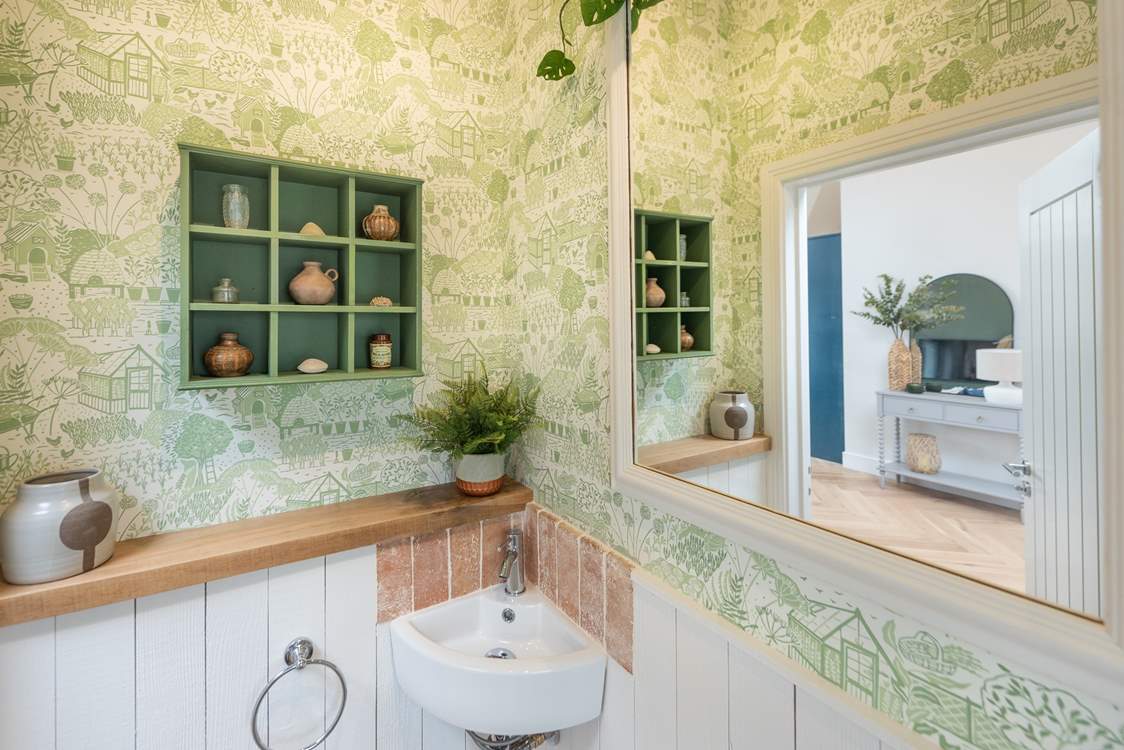 Loving the wallpaper in the cloakroom.