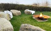 Warm up by the fabulous fire-pit. - Thumbnail Image