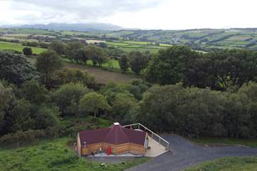 With spellbinding views across rolling fields towards Snowdonia National Park.