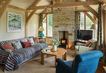 With a warming wood-burner, this space is perfect to get cosy on those chillier evenings.
