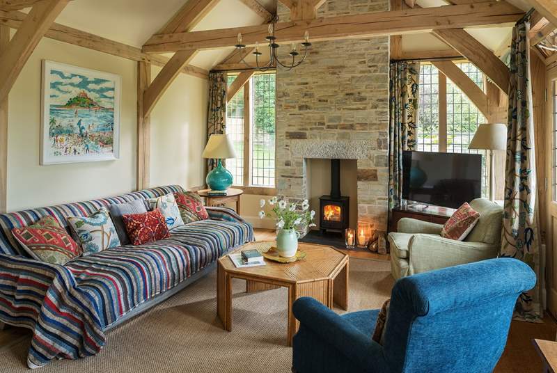 With a warming wood-burner, this space is perfect to get cosy on those chillier evenings.