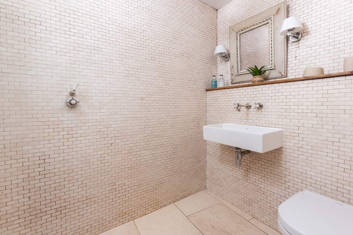 The wet-room is tiled throughout.