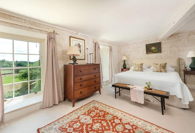 A wonderfully light and airy room, with a huge super-king bed and views over the surrounding countryside.