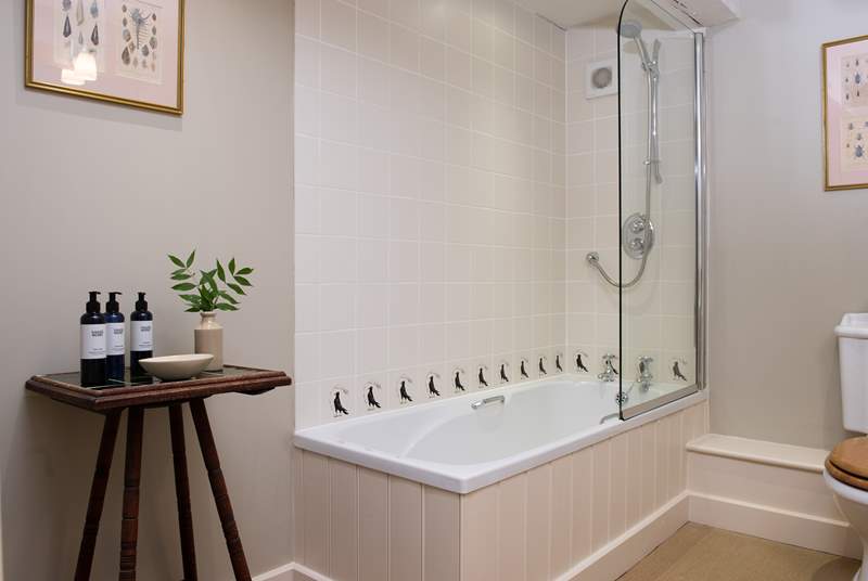 An en suite bathroom complete with overhead shower.
