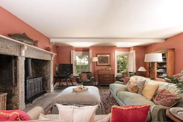 The large fireplace is the focal point of the room with the all important wood-burning stove for those out-of-season breaks.
