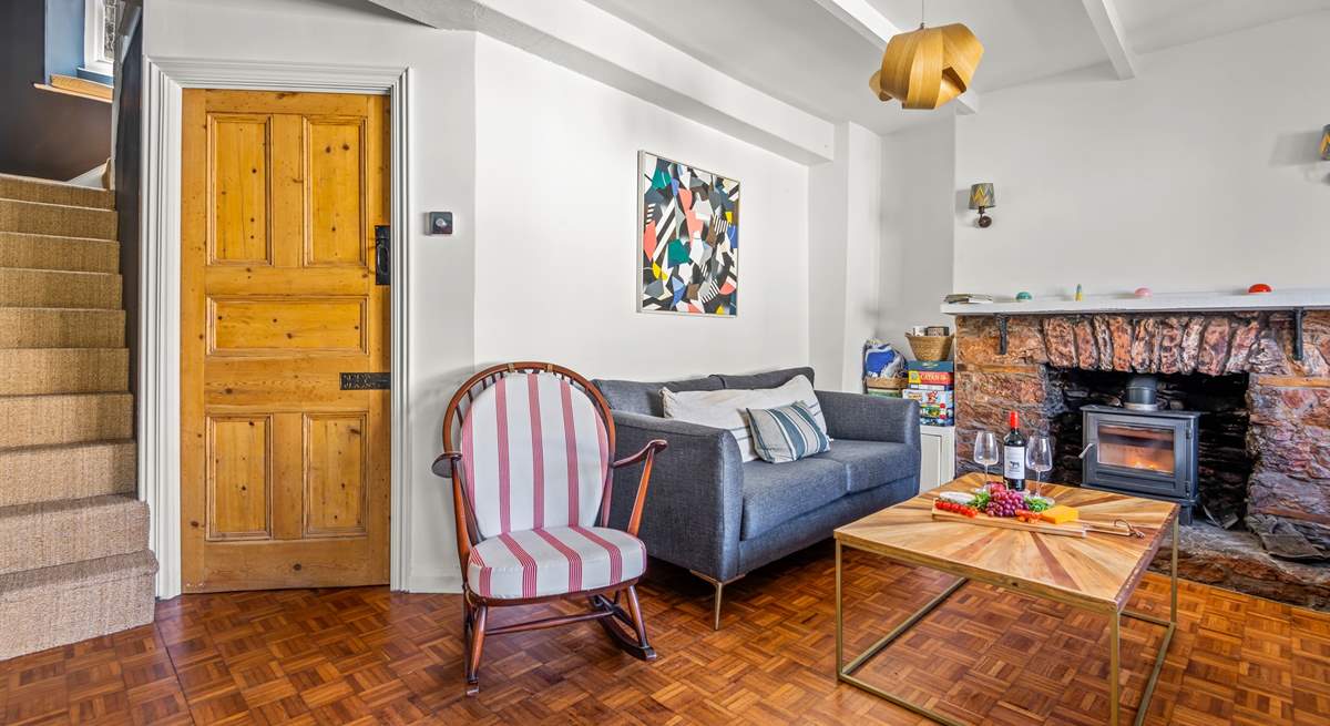 The sitting-room leads into the kitchen and up the stairs to the first floor bedrooms and family bathroom.