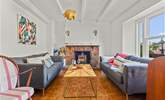 The bright and airy sitting-room. Please note, there is now a brand new Smart TV situated on the wall to the left of the wood-burner. - Thumbnail Image