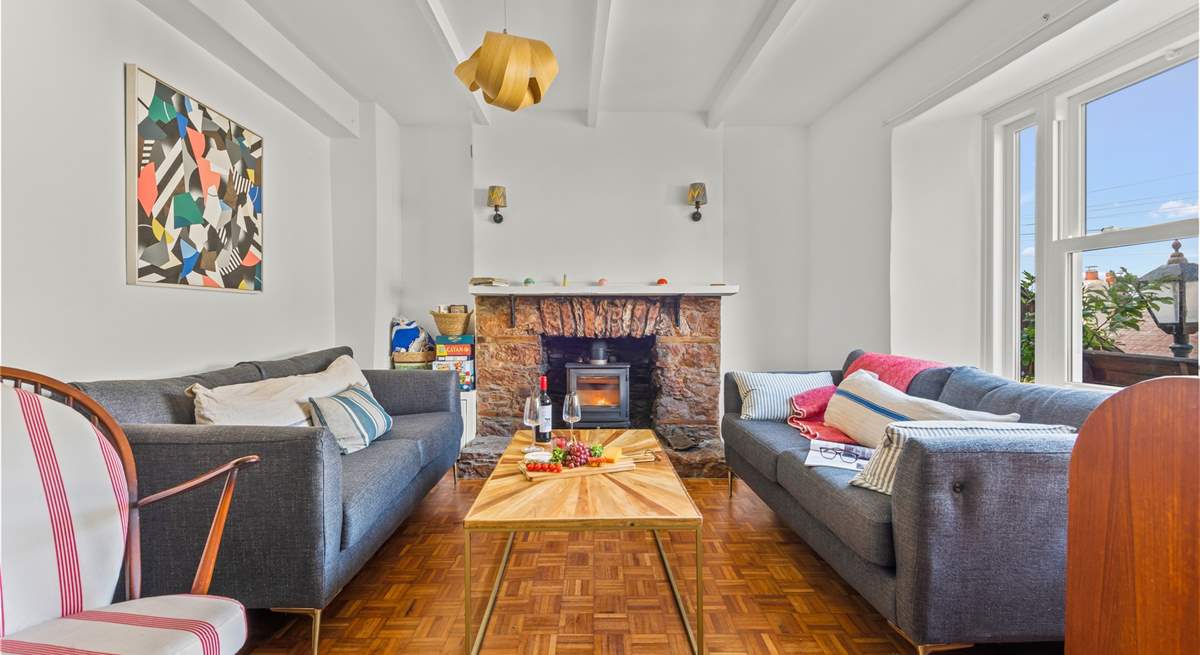 The bright and airy sitting-room. Please note, there is now a brand new Smart TV situated on the wall to the left of the wood-burner.