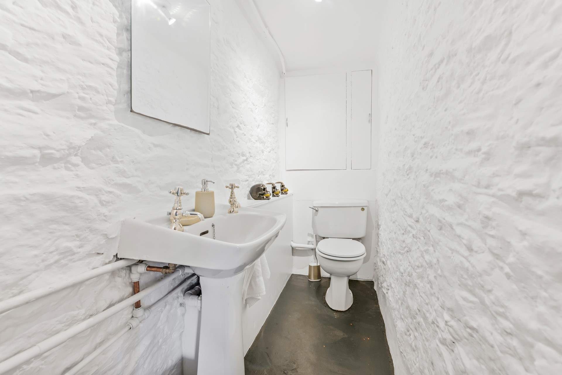 The ground floor WC and wash-basin.