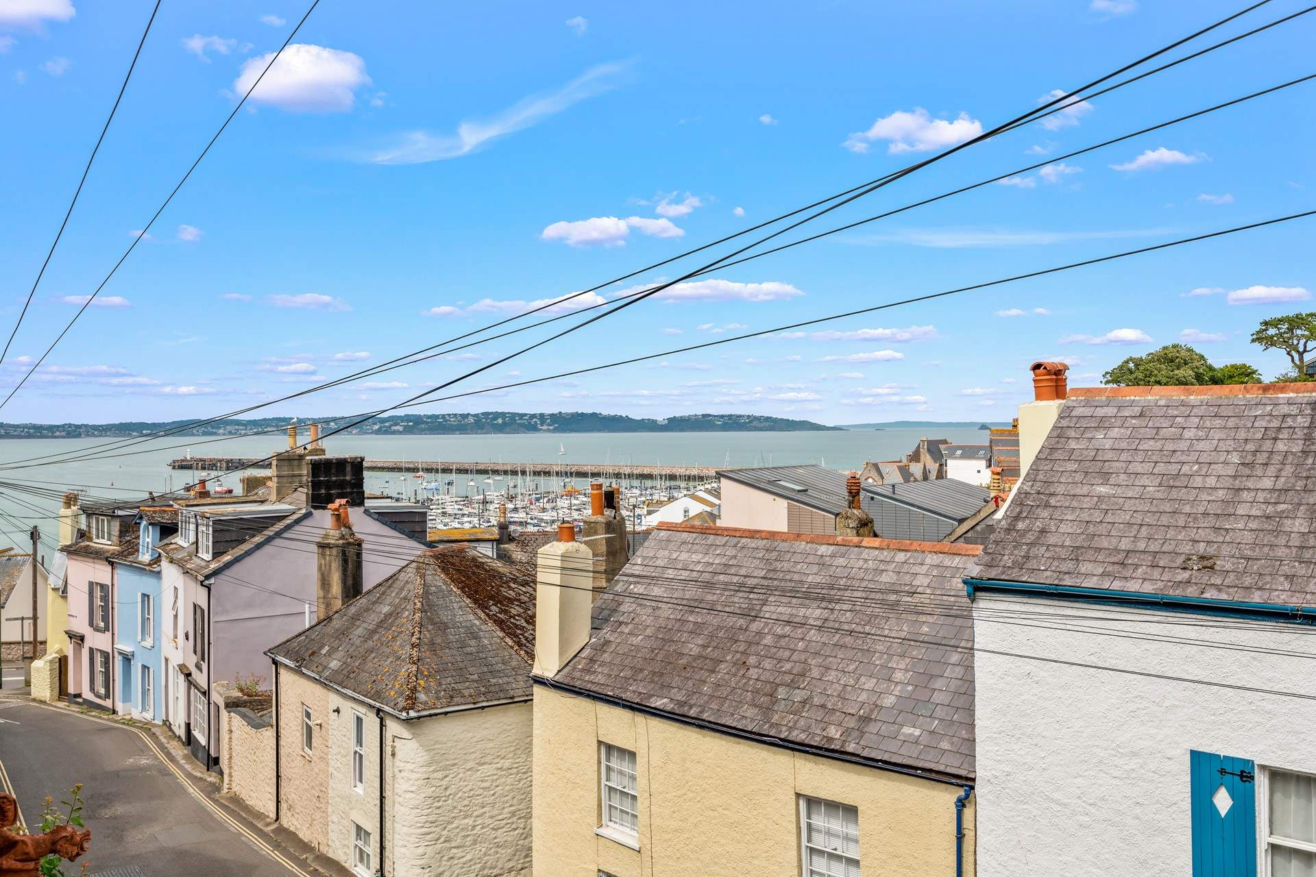 The view from your external seating-area, down to the harbour and out to sea. You are so close to the harbour, you can almost touch it.