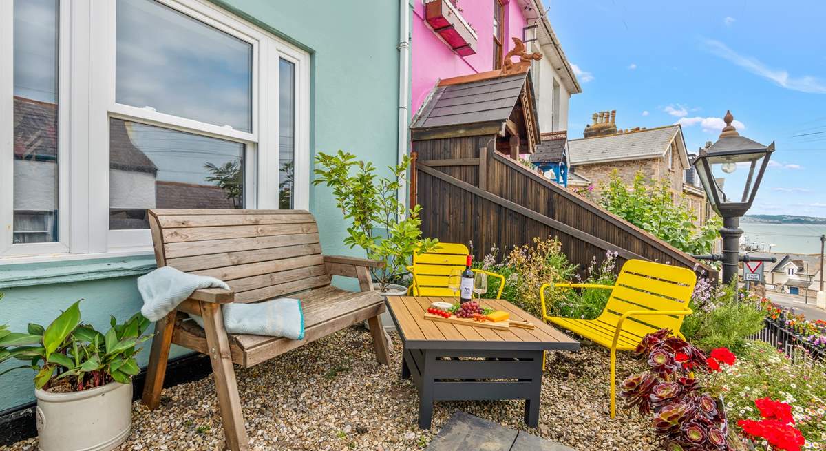 Welcome to Captains Cottage. You can enjoy views out to sea from your raised seating-area.