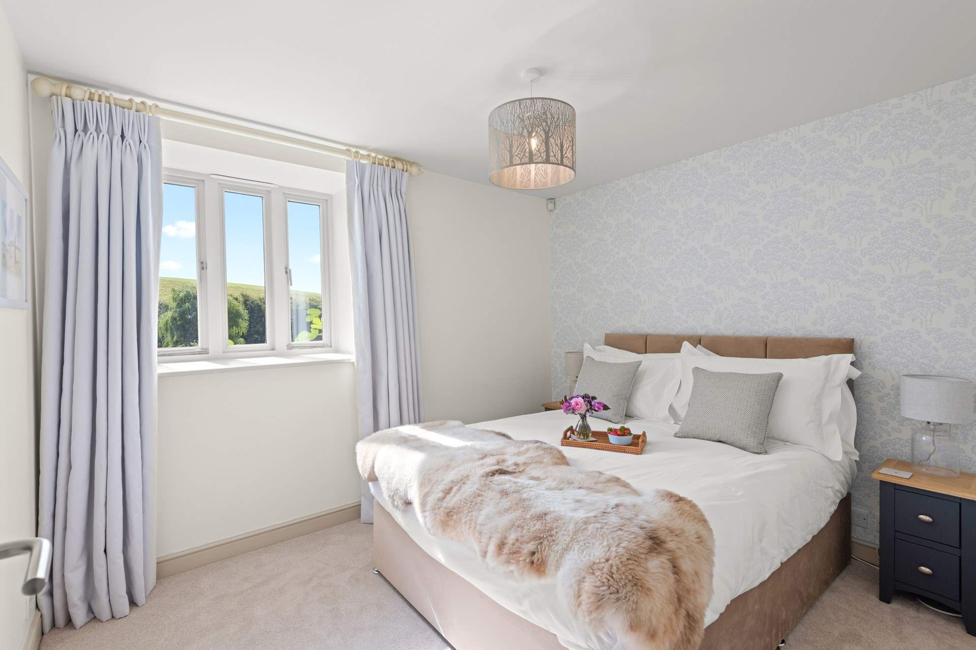 The lovely bedroom has a king-size double.