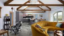 The cheerful open plan living area is enough to make anyone smile.