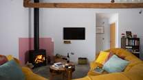 The sofa is comfy and cosy. Wallow in the heat from the wood-burner and relax after a day exploring the forest.