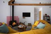 The sofa is comfy and cosy. Wallow in the heat from the wood-burner and relax after a day exploring the forest.