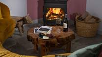 Stoke up the fire, pour a glass of wine and pull up the cute 'cow' side table.