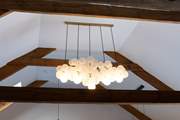 Uber trendy light fittings sit alongside the original beams, a marriage of old and new.