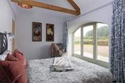 Original beams adorn bedroom 2.
