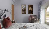 King-size bedroom 2 showcases vintage artwork and full width French windows.  - Thumbnail Image