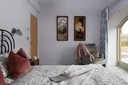 King-size bedroom 2 showcases vintage artwork and full width French windows.