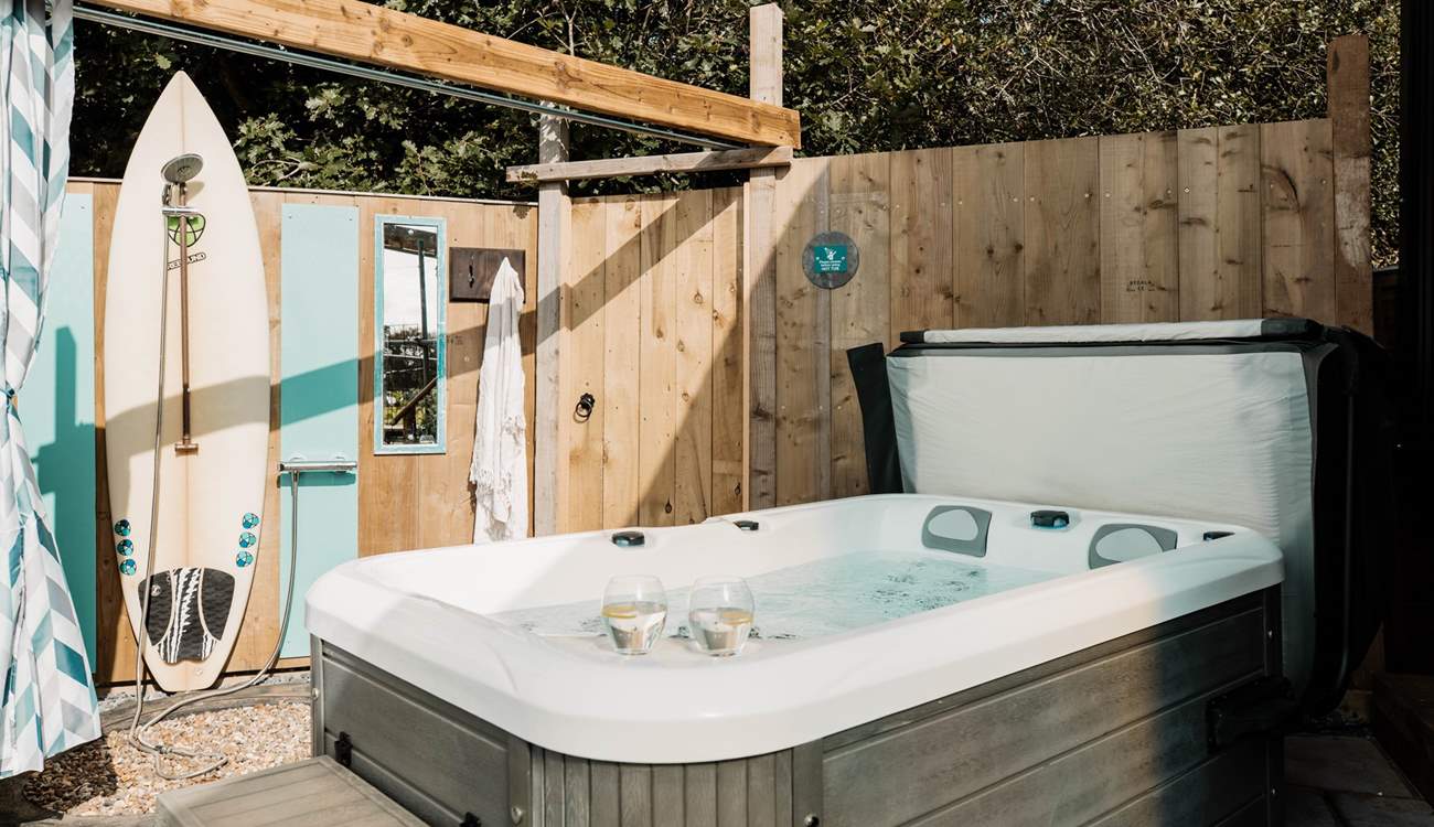 We love the al fresco shower, upcycled using the owners surfboard!