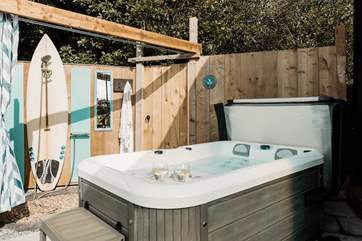We love the al fresco shower, upcycled using the owners surfboard!