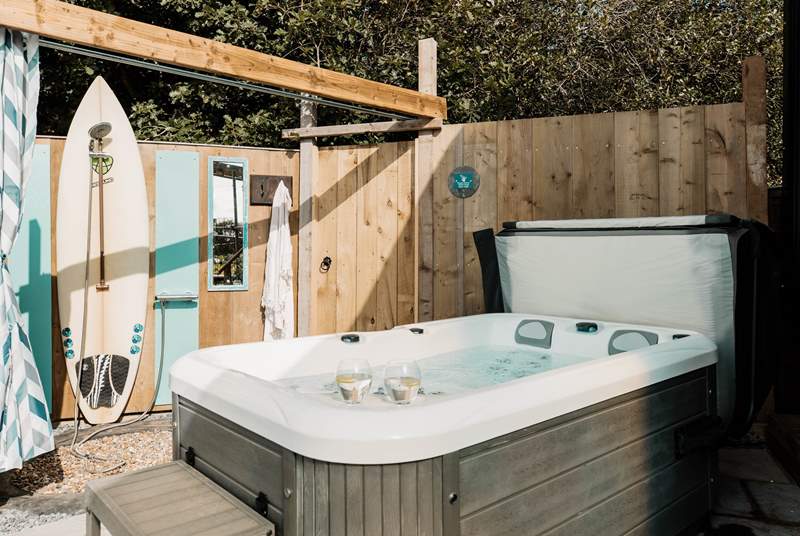 We love the al fresco shower, upcycled using the owners surfboard!