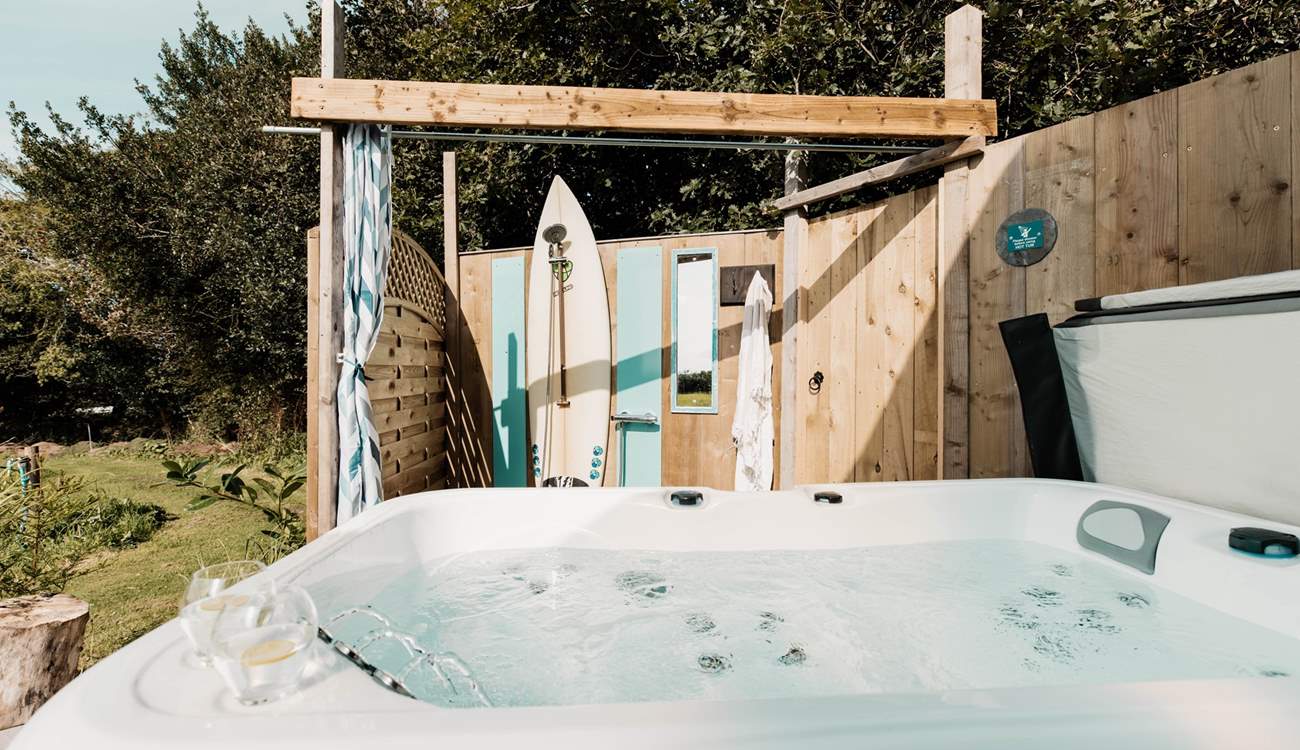 There's a bubbling hot tub and an al fresco shower for magical moments under starlight. 
