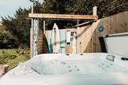 There's a bubbling hot tub and an al fresco shower for magical moments under starlight. 